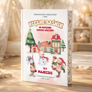 Okładka książki zatytułowanej "Piękne Baśnie na rodzinne zimowe wieczory" z ilustracjami postaci świątecznych, takich jak renifer i bałwan, w zimowym krajobrazie z domem i choinką. W dolnej części widnieje dedykacja dla 'Majeczki' od 'Cioci Ewy'.