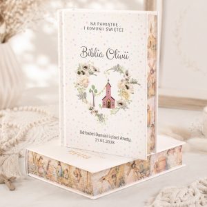 Książka z okładką ozdobioną ilustracją kościoła i kwiatami, oznaczona napisem "Biblia Oliwii" oraz datą 21.05.2028.
