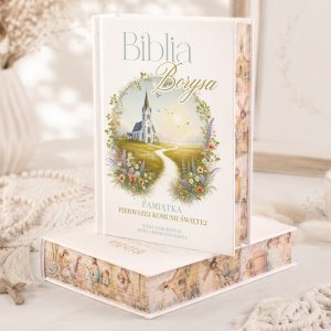 Biblia w eleganckiej oprawie z ilustracją kościoła i ścieżką, podpisana "Pamiątka Pierwszej Komunii Świętej".
