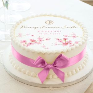 Personalizowany opłatek na tort komunijny z imieniem dziecka i różową magnolią