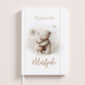 Notes with a soft illustration of a bear embracing a sheep, featuring the title "Rysownik" and the name "Martynki" on the cover.