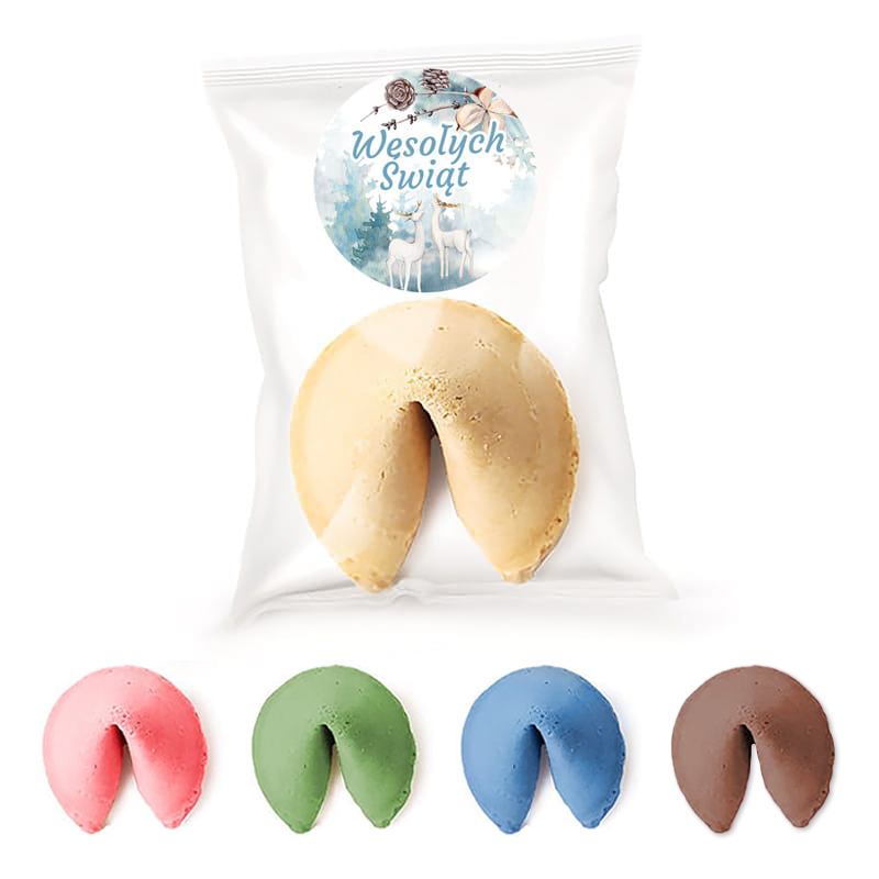 Zestaw ciastek w kształcie wróżb z opakowaniem oznaczonym napisem 'Wesołych Świąt', w którego wnętrzu znajduje się żółte ciastko oraz cztery różnokolorowe ciastka: różowe, zielone, niebieskie i brązowe.
