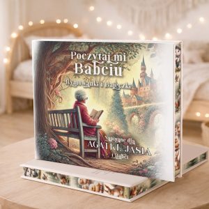 Książka "Poczytaj mi Babciu" z ilustracją staruszki siedzącej na ławce, czytającej dziecku w malowniczym otoczeniu.