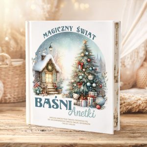 Książka zatytułowana "Magiczny Świat Baśni Anetki" z ilustracją przedstawiającą zimowy krajobraz z domkiem i choinką.