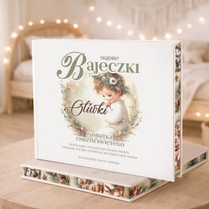 Książka z delikatną ilustracją dziecka, ozdobiona roślinnymi motywami, z napisem "Mądre Bajeczki" i "Pamiątka Chrztu Świętego".