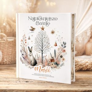 Książka "Najpiękniejsze Baśnie" z piękną okładką, przedstawiającą zająca, drzewo, gwiazdy i delikatne dekoracje świąteczne.