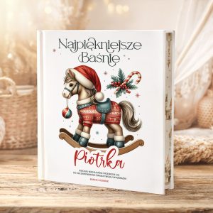 Książka "Najpiękniejsze Baśnie" z ilustracją konika na biegunach w czerwonym kapeluszu, ozdobiona bożonarodzeniowymi detalami.