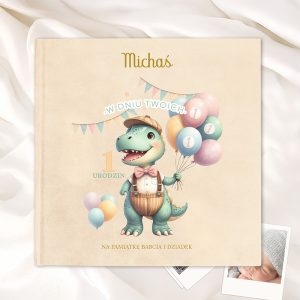 Okładka książki z ilustracją małego dinozaura trzymającego balony, w otoczeniu kolorowych banerów i z napisem '1 URODZIN', stylizowana na przyjęcie urodzinowe.