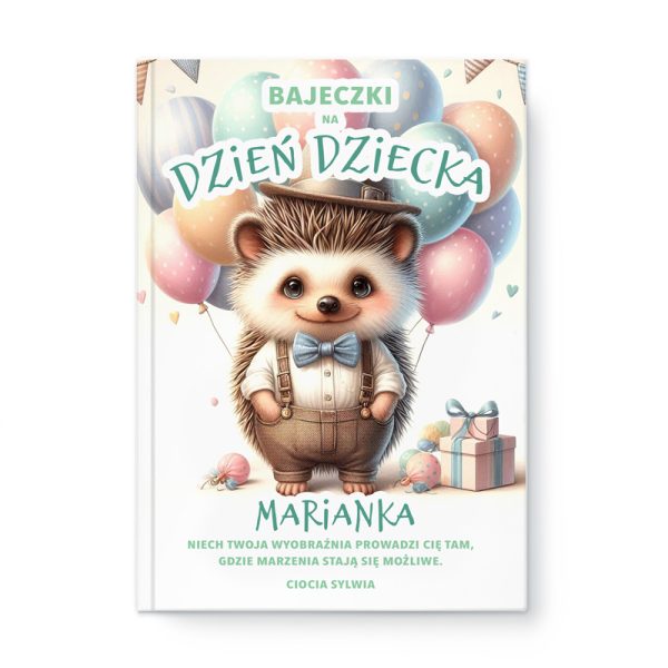Okładka książki przedstawiająca uroczego jeża w eleganckim stroju z muszką, trzymającego ręce na biodrach. W tle znajdują się balony w różnych kolorach oraz dziecięce prezenty. Na górze napis "BAJECZKI na Dzień Dziecka", a na dole napis "MARIANKA" oraz zachęta do marzeń od "Cioćki Sylwii".