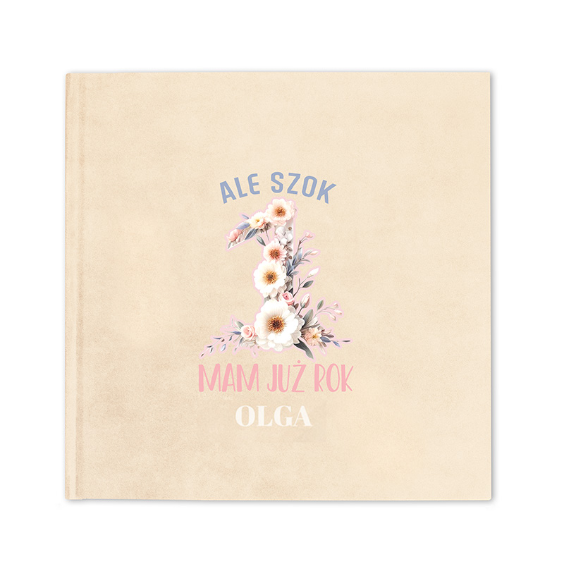 Okładka książki w jasnym kolorze z napisami: 'ALE SZOK', '1', 'MAM JUŻ ROK' oraz imieniem 'OLGA', ozdobiona kwiatami.