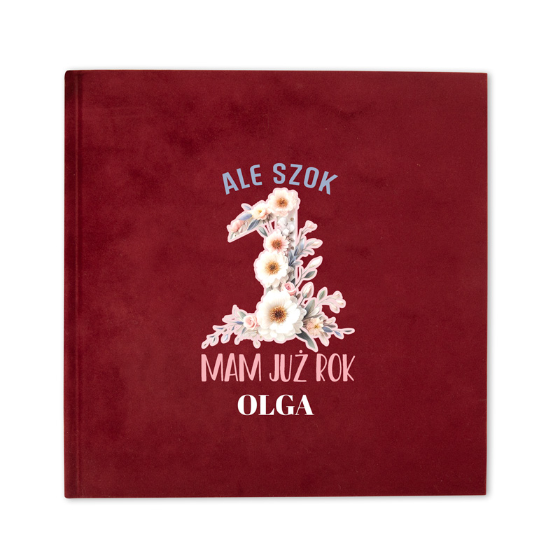 Okładka albumu w kolorze burgundowym z dużą cyfrą '1' ozdobioną kwiatami, napisy: 'ALE SZOK' u góry, 'MAM JUŻ ROK' poniżej cyfr i imię 'OLGA' na dole.