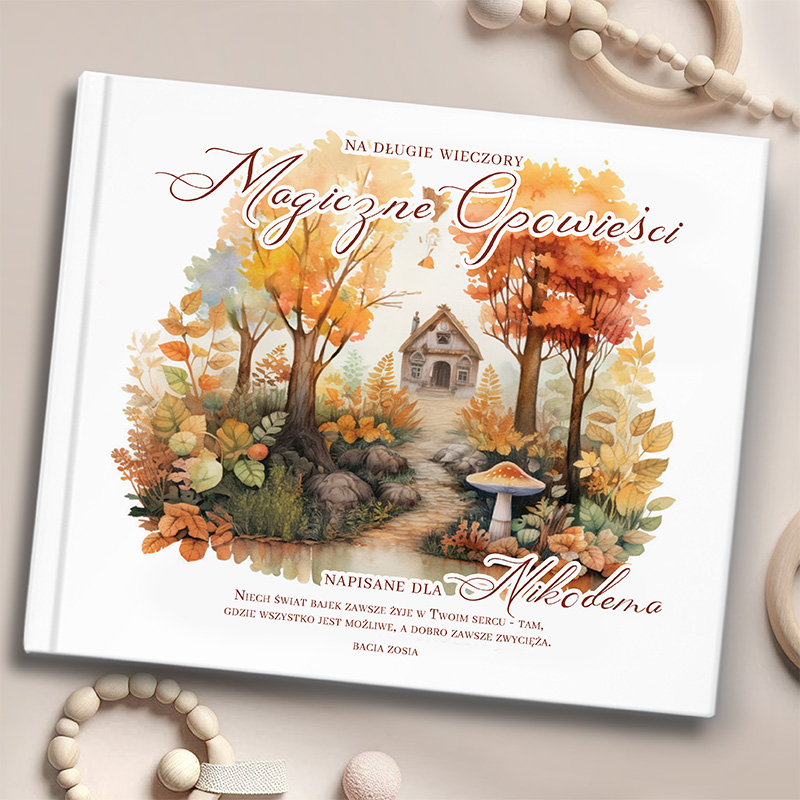 Ozdobna okładka książki z tytułem 'Magiczne Opowieści', na której widać dom w otoczeniu drzew z kolorowymi liśćmi i grzybem, w jesiennej scenerii. Na okładce znajduje się również dedykacja 'Napisane dla Nikodena'.