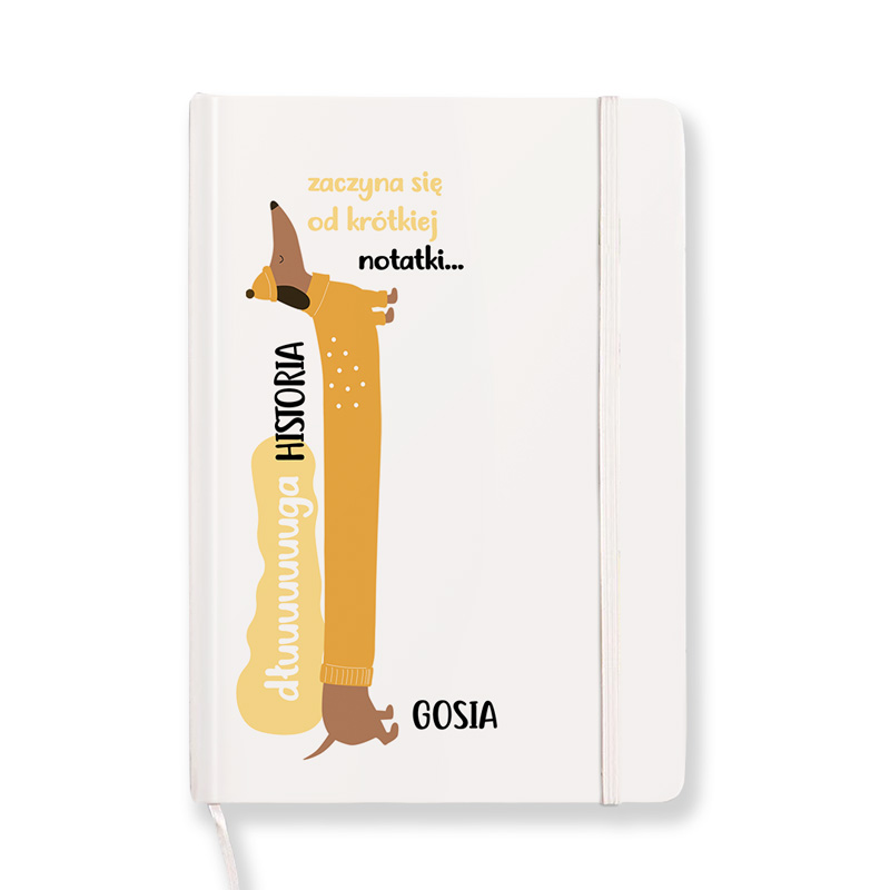 Notebook cover featuring a cartoon dachshund with a yellow body, wearing a hat, alongside the text in Polish that reads "zacyna się od krótkiej notatki..." and "dłuuuuga HISTORIA" with the name "GOSIA" at the bottom.