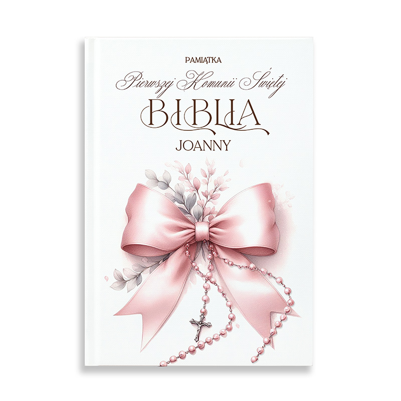 Okładka książki z napisem 'Pamiątka Pierwszej Komunii Świętej Biblia Joanny', dekorowana różową kokardą i kwiatowymi motywami, ozdobiona koralikami i krzyżykiem.