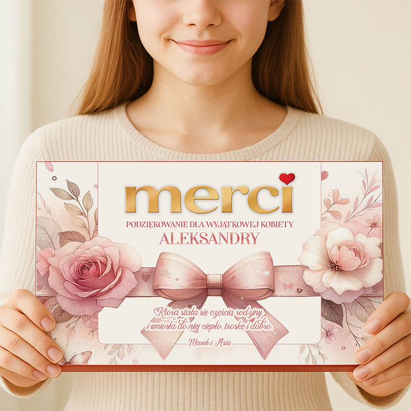 Kobieta trzyma w dłoniach certyfikat z napisem "merci" i kolorowymi kwiatami, podziękowanie.