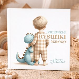 Książka z tytułem "Pierwsze Rysunki Małego" przedstawiająca chłopca w piżamie z przytulnym dinozaurem.